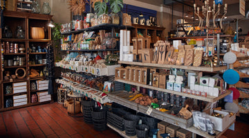 Store interior with shelves stocked with various products and decor items.