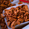 Close-up of glazed Holiday Fried Pecans in a white bowl