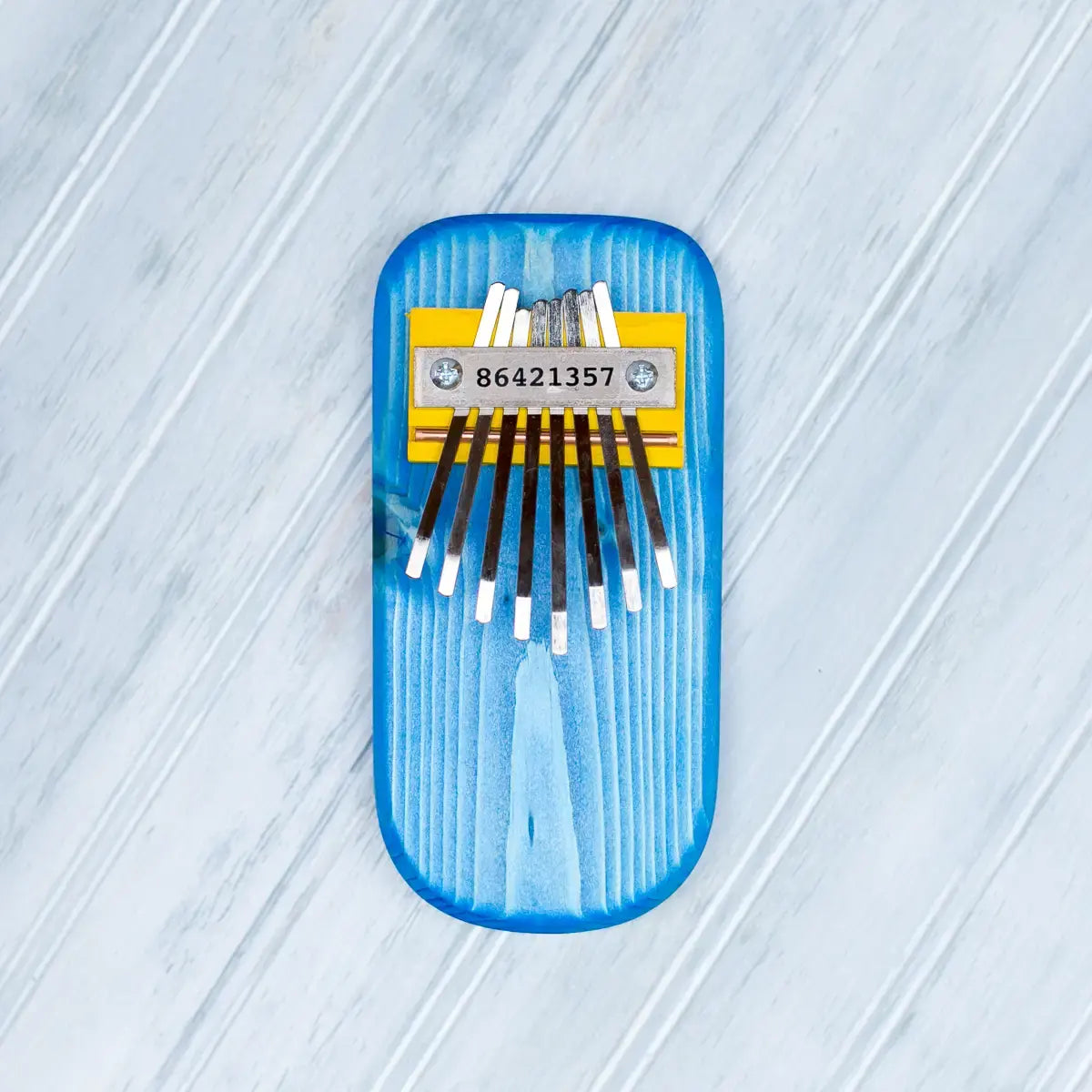 thumb piano - color by mountain melodies, llc