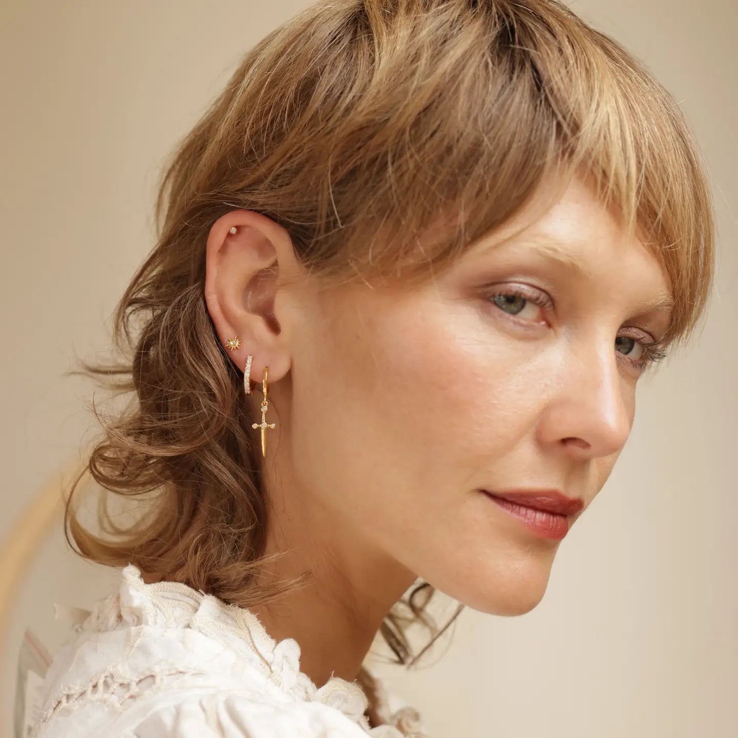 earrings - huggie hoops - dagger - 14kgp by amano studio