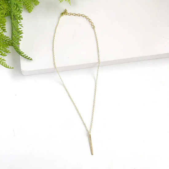 necklace - dangling bar pendant - gold by worldfinds