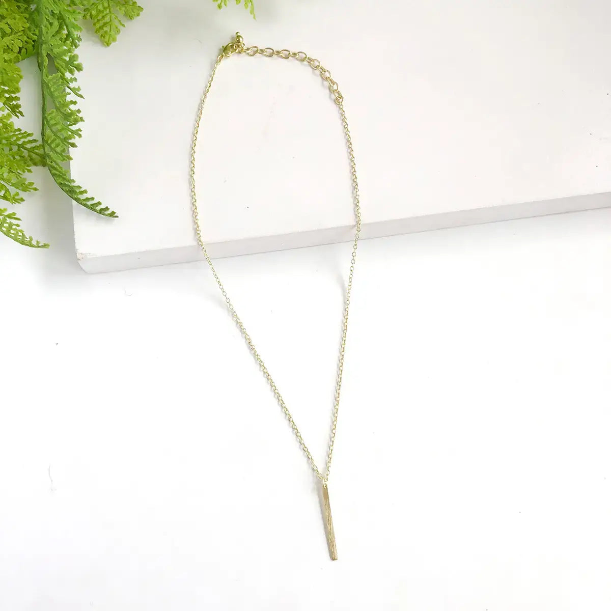 necklace - dangling bar pendant - gold by worldfinds