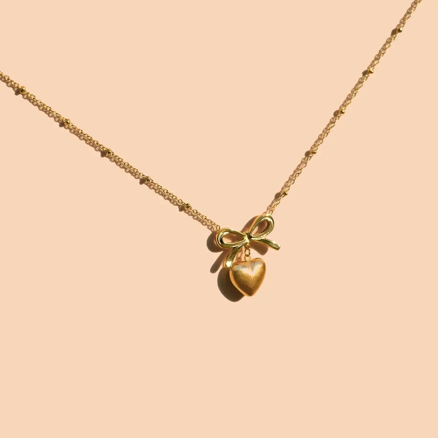 necklace - effie heart + bow - 18kgp by peter and june