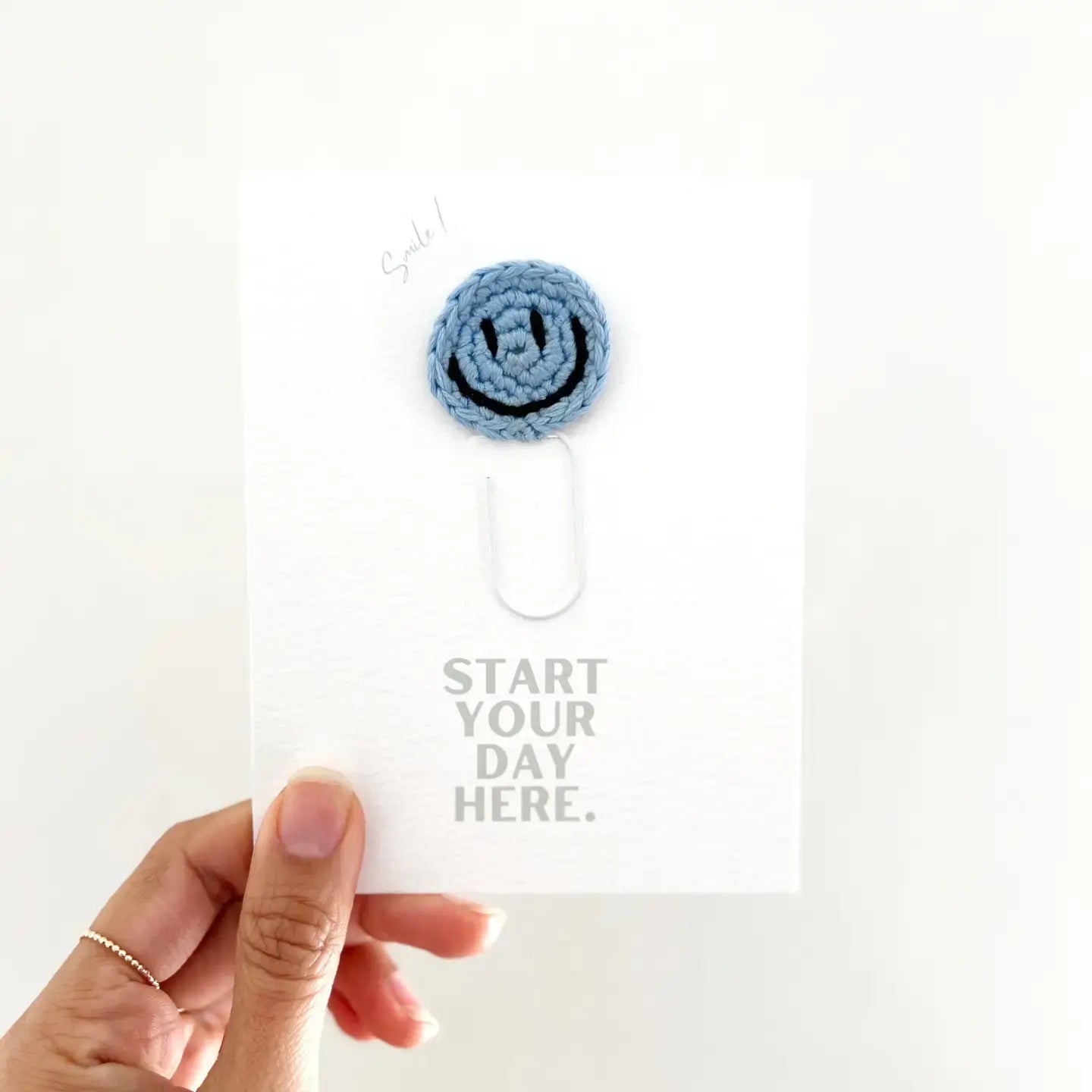 bookmark - paperclip - happy face by impactful market