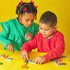 game - dominoes - topple twist by kikkerland