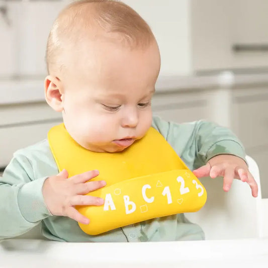 baby silicone starter bib - "little bites" by bella tunno