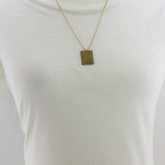 necklace - brass plaque - "one inch" by brass sand
