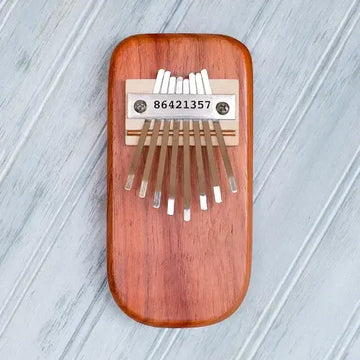 thumb piano - padauk wood by mountain melodies, llc