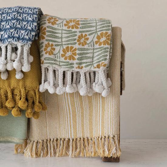 throw blanket - flowers + braided poms by creative co-op