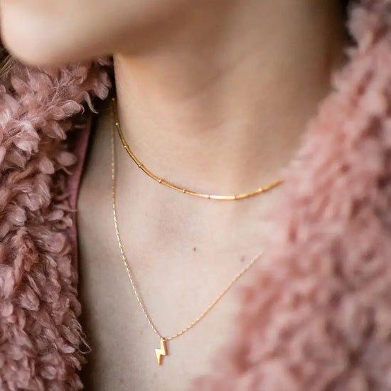 necklace - tiny lightning bolt - 20" chain - 14kgp by amano studio